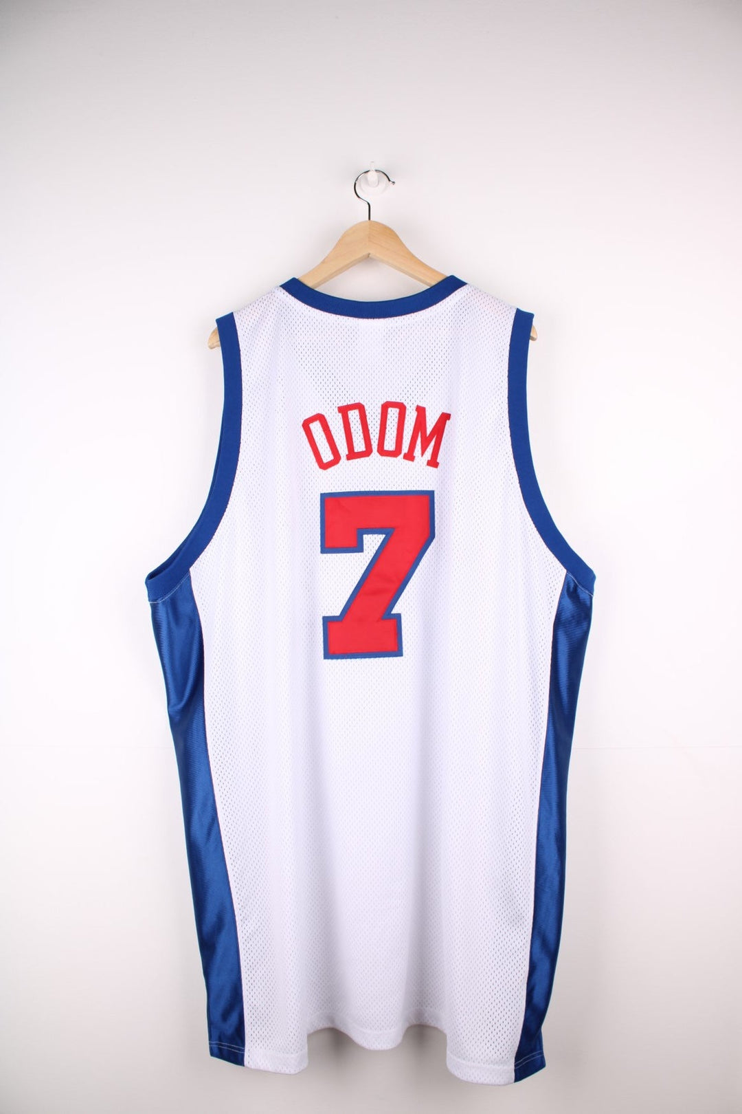 LA Clippers NBA jersey in white with blue and red accents, multiple embroidered logos, and no.7 Odom on the back.