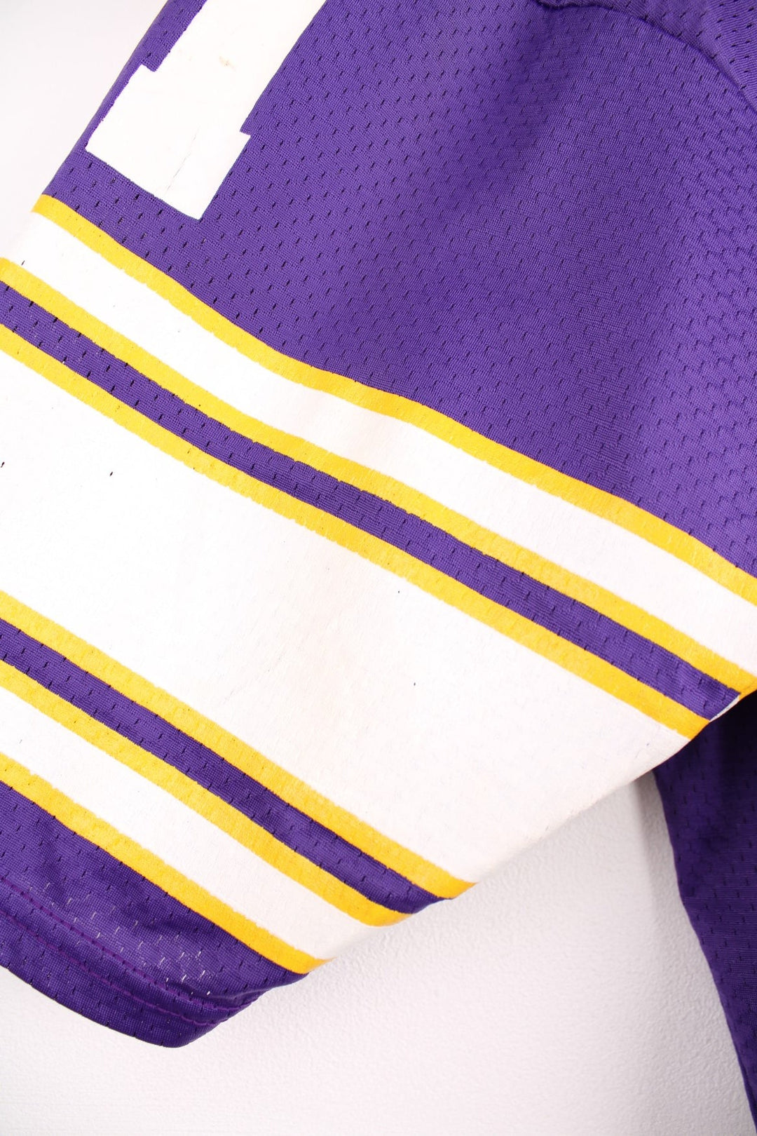  Champion Minnesota Vikings NFL jersey in purple with yellow and white accent stripes, an embroidered logo on the sleeve, and no.81 on the front, back and each sleeve.