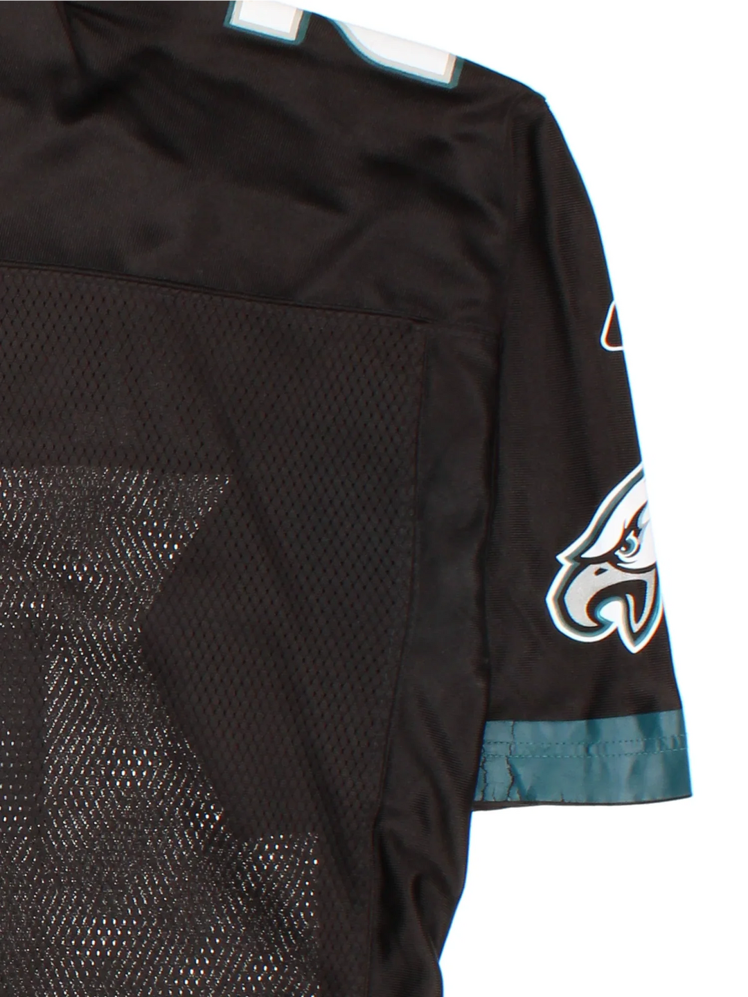 Philadelphia Eagles Reebok NFL Jersey in the black colourway, features printed logos and player name MCCOY #25 on the back. Green trimming around the sleeves and collar.