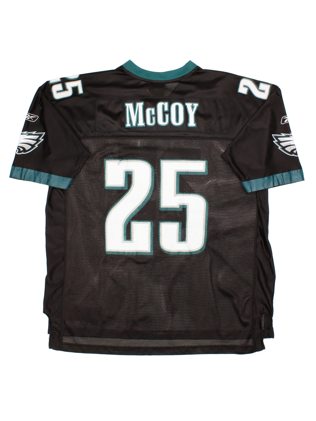 Philadelphia Eagles Reebok NFL Jersey in the black colourway, features printed logos and player name MCCOY #25 on the back. Green trimming around the sleeves and collar.