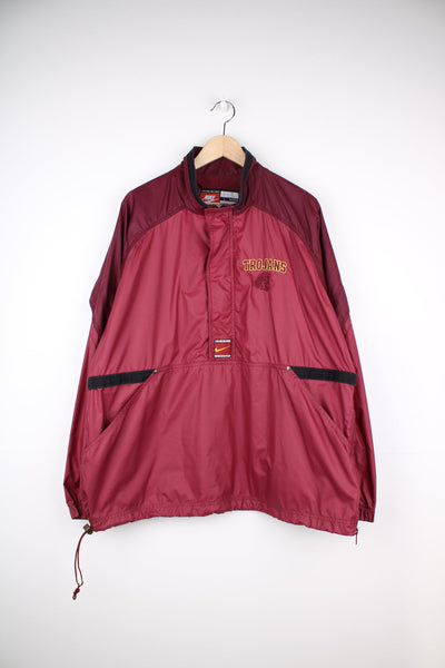 vintage 90's Nike USC Trojans maroon 1/4 nylon track jacket with embroidered patches on the front and back