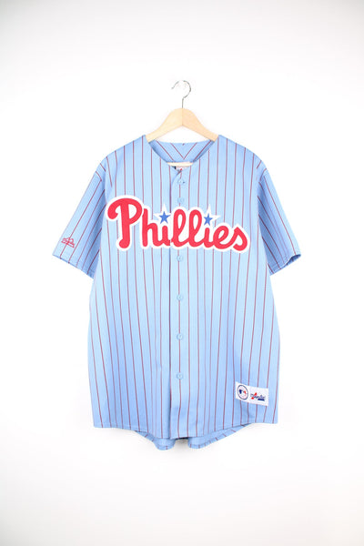 Vintage Philadelphia Phillies powder blue pinstripe baseball jersey by Majestic. Features embroidered spell-out details and logos