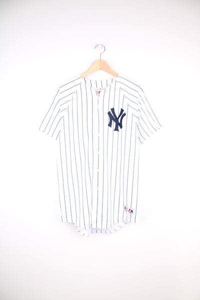 Vintage New York Yankees #2 Derek Jeter MLB jersey by Majestic. Features embroidered lettering and pinstripe print