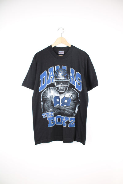 Dallas Cowboys black t-shirt with printed spell-out graphic on the front 