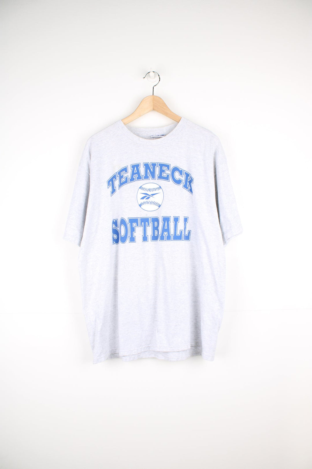 Vintage Reebok Teaneck Softball single stitch T-Shirt in grey, with blue print on the front and back.