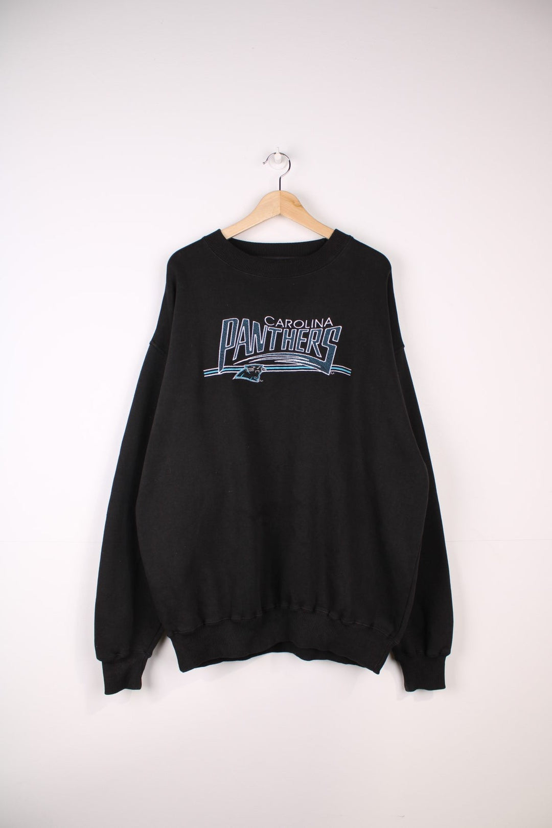 Carolina Panthers NFL Sweatshirt in a black colourway with the team logo and spell out embroidered across the front.