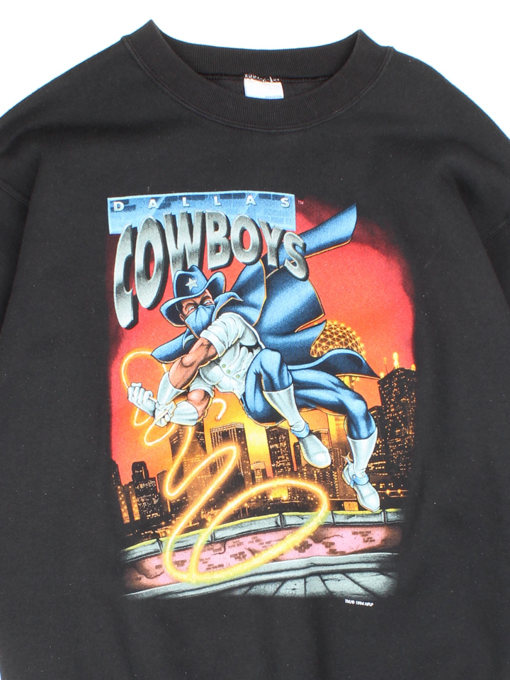 1994 Dallas Cowboys Salem Sportswear Comic Sweatshirt in a black colourway with superhero style comic graphic design printed on the front. 