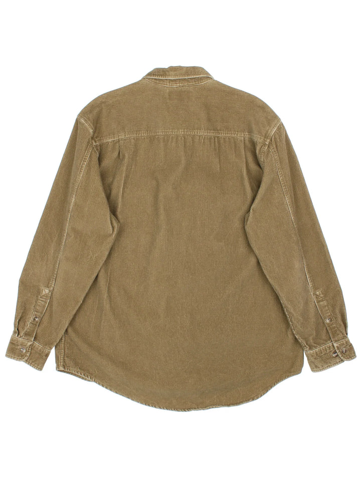 Timberland Corduroy Shirt in a brown colourway. Button up fastening, with front patch pockets and embroidered branded tab.