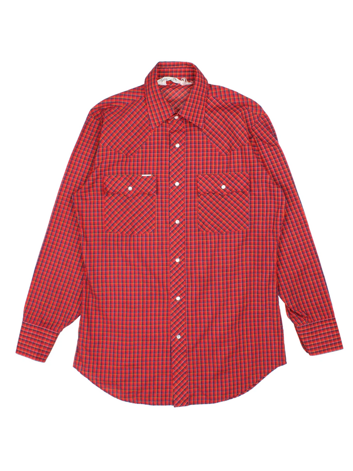Vintage Chute #1 Western Shirt in a red and navy blue plaid patterned colourway, buttons up and has double chest pockets with the logo tab embroidered on the front.