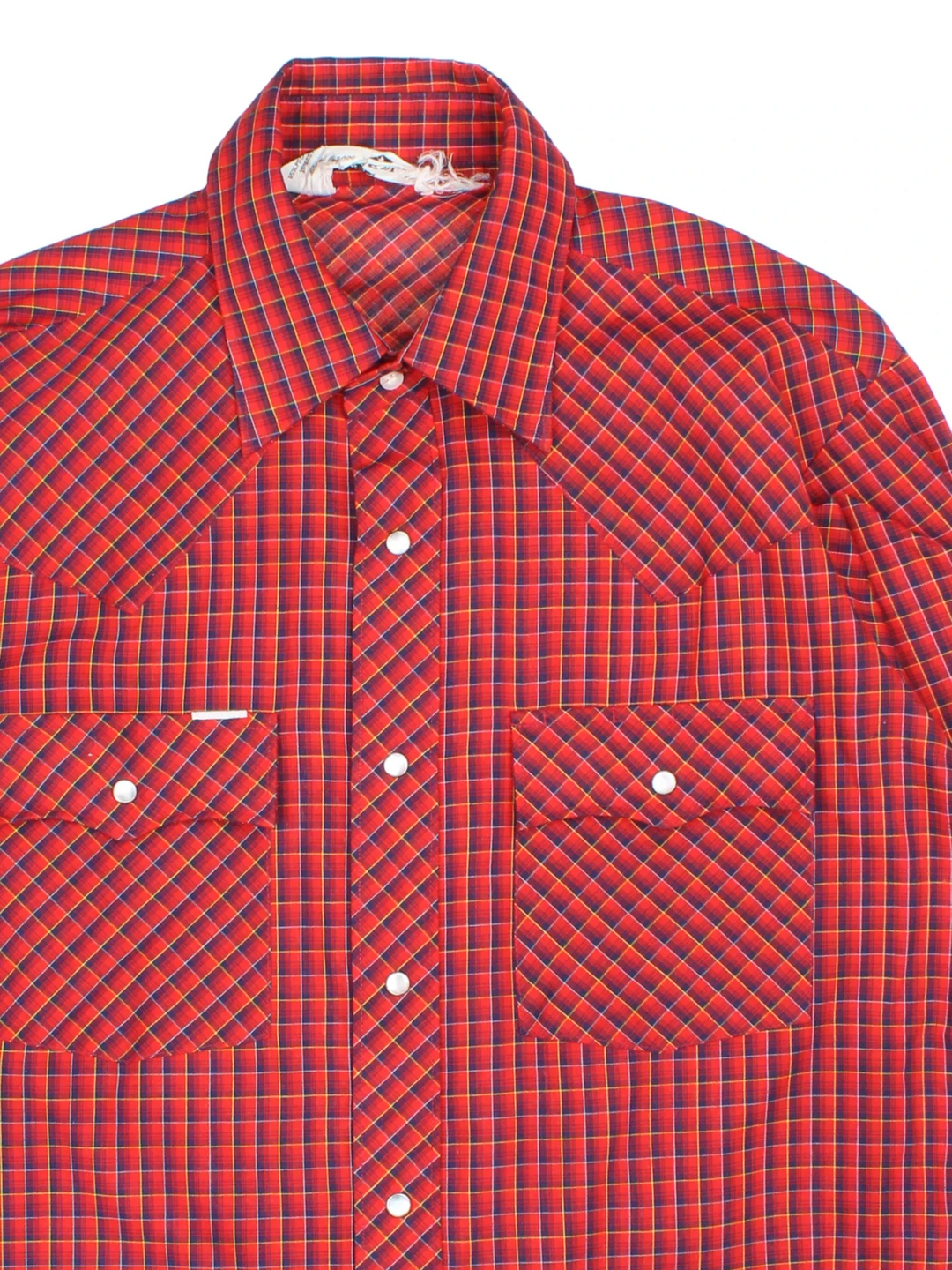 Vintage Chute #1 Western Shirt in a red and navy blue plaid patterned colourway, buttons up and has double chest pockets with the logo tab embroidered on the front.