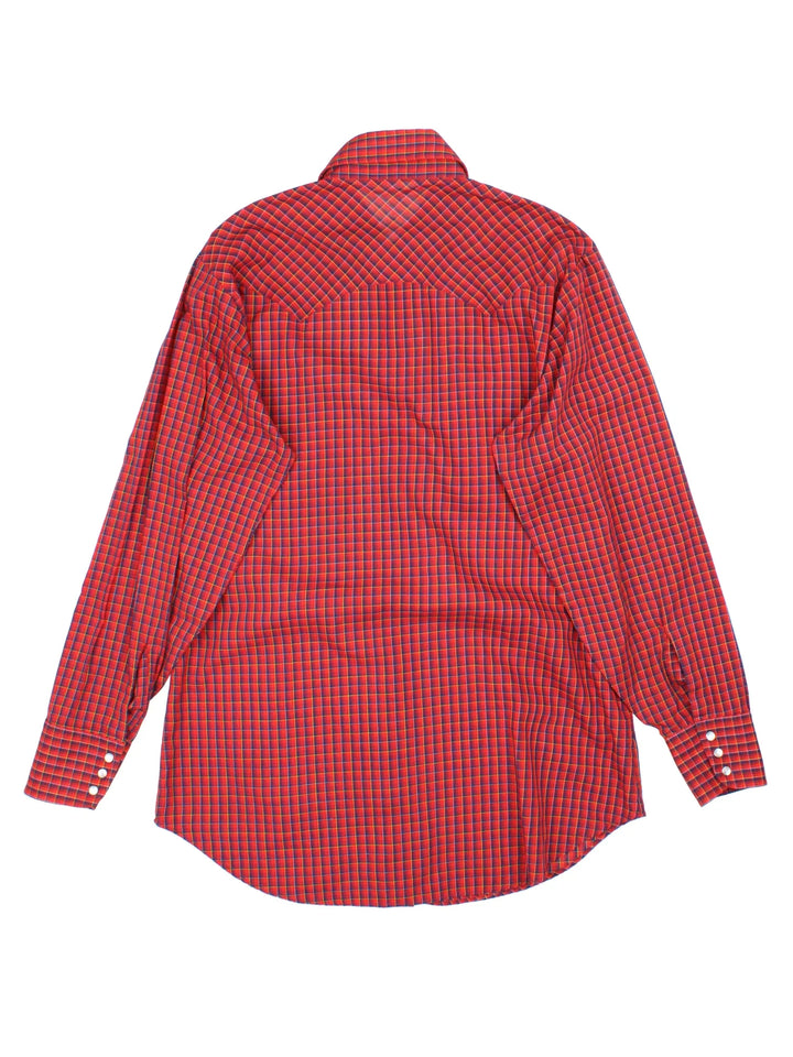 Vintage Chute #1 Western Shirt in a red and navy blue plaid patterned colourway, buttons up and has double chest pockets with the logo tab embroidered on the front.