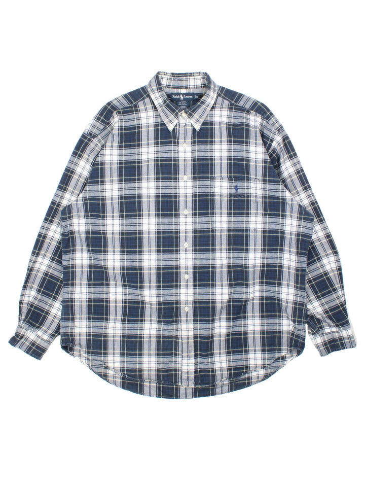 Ralph Lauren Shirt in a blue and white checked colourway, buttons up and has a chest pocket with the logo embroidered on the front.