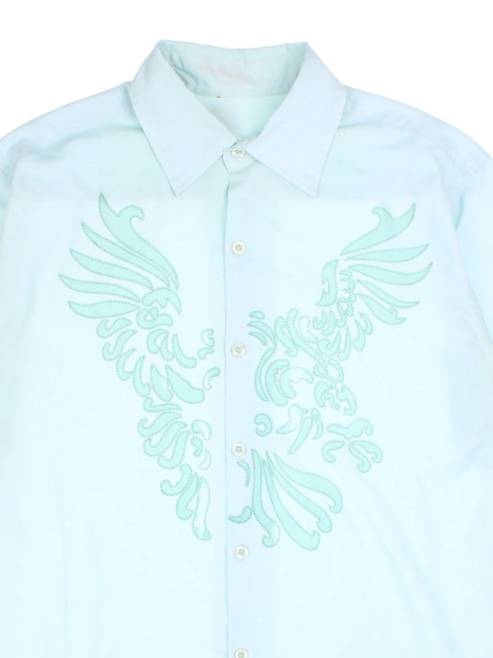 Vintage Printed Shirt in a blue colourway. Button up with front abstract pattern detail.