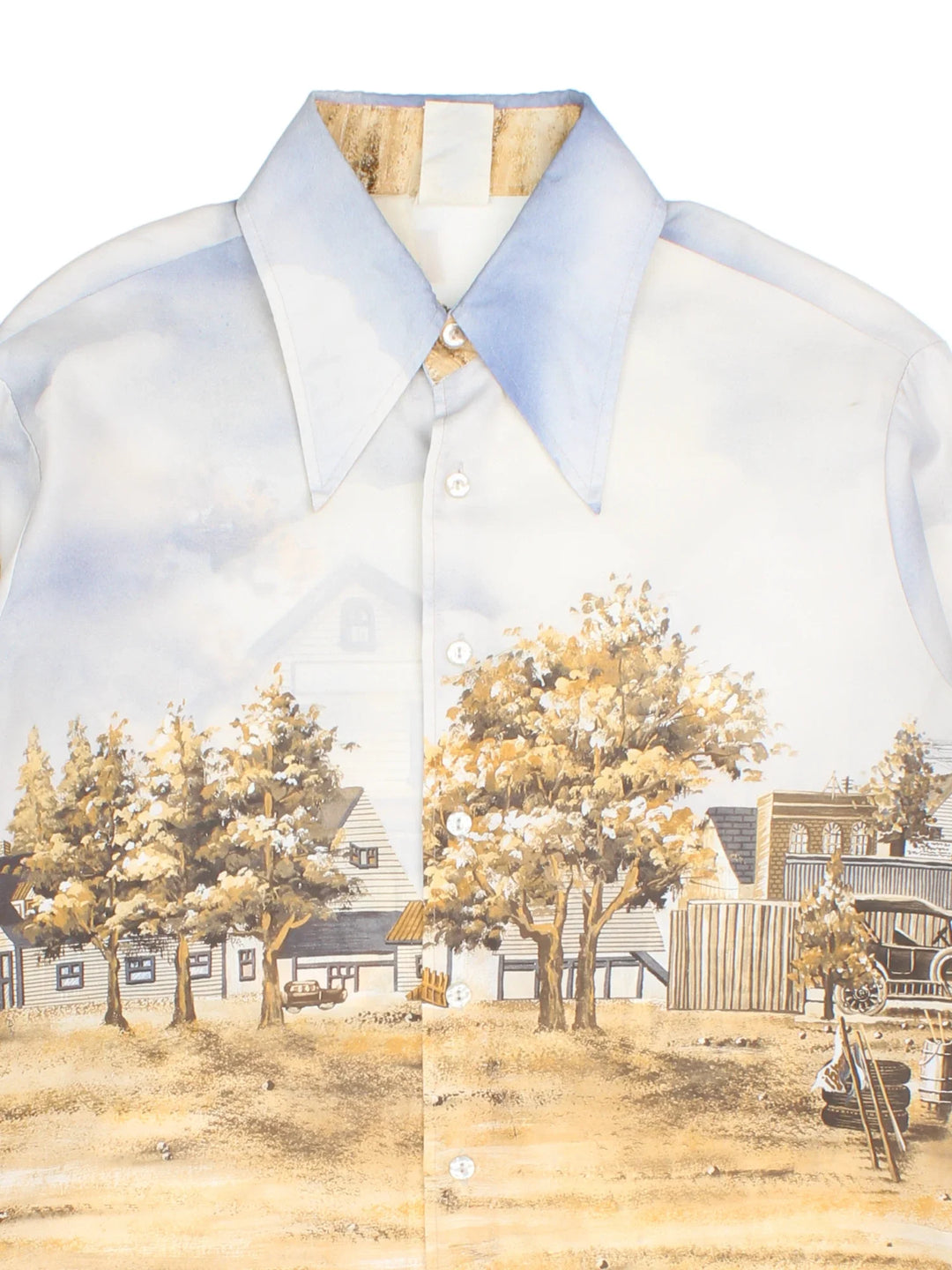 Vintage 80's Kennington Disney Shirt in a blue/tan colourway. Button up with all over print and dagger collar.