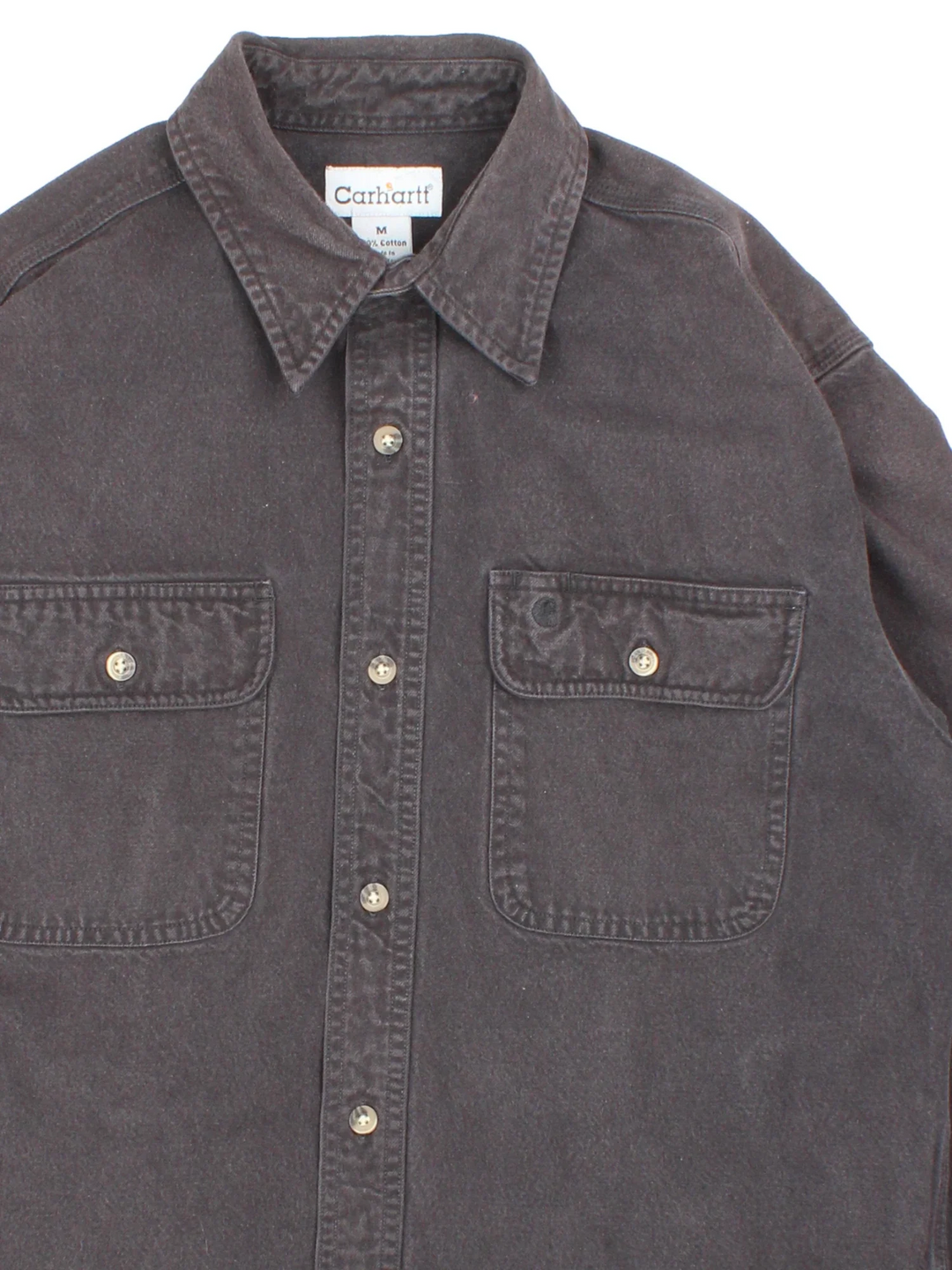 Carhartt Heavy Work Shirt in a black colourway, buttons up and has double chest pockets with the logo embroidered on the front.