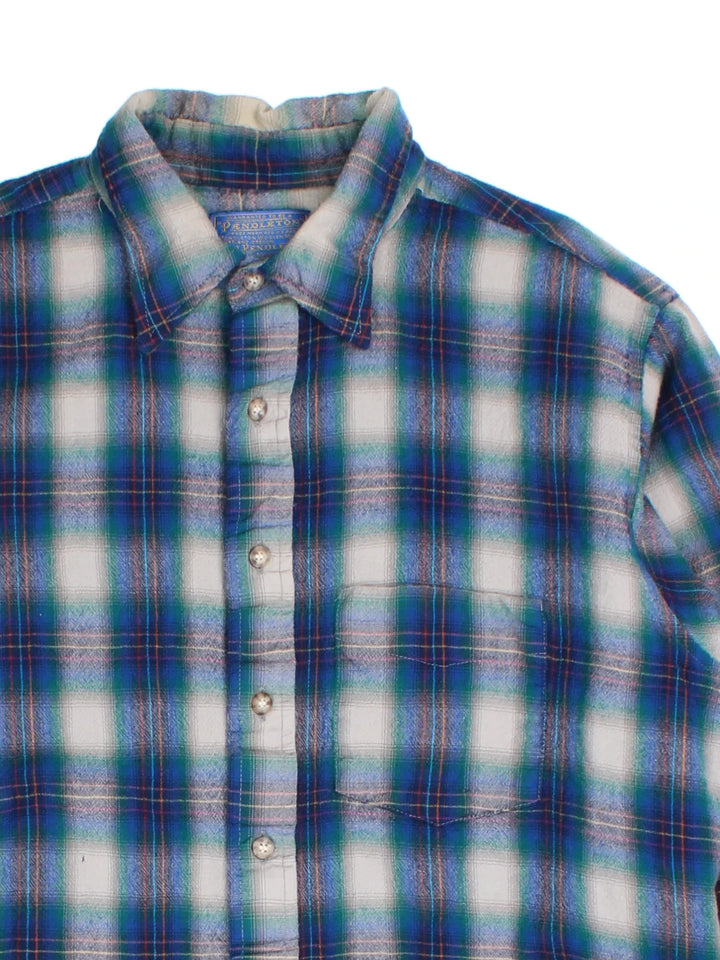 Pendleton Wool Flannel Shirt in a blue, grey and green plaid colourway, buttons up and has a chest pocket on the front.