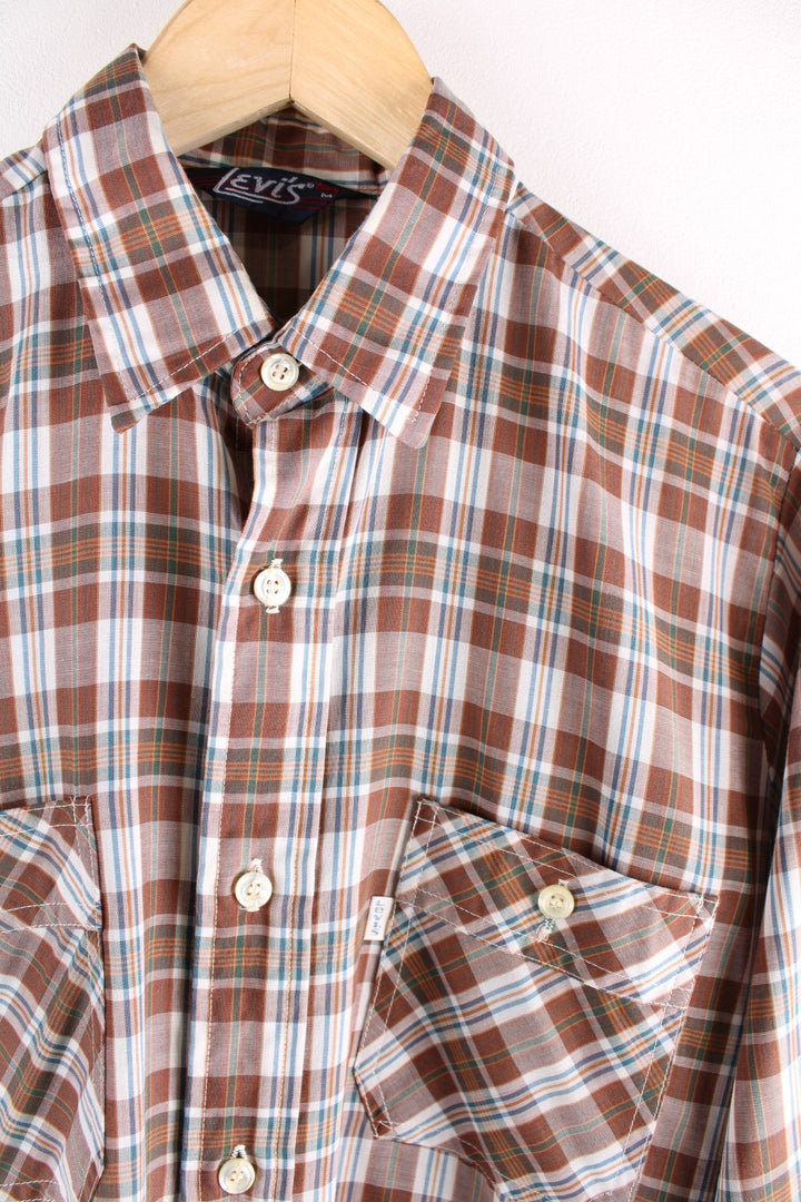 Levi Strauss white tab shirt in brown, white, and blue check, with two buttoned pockets.