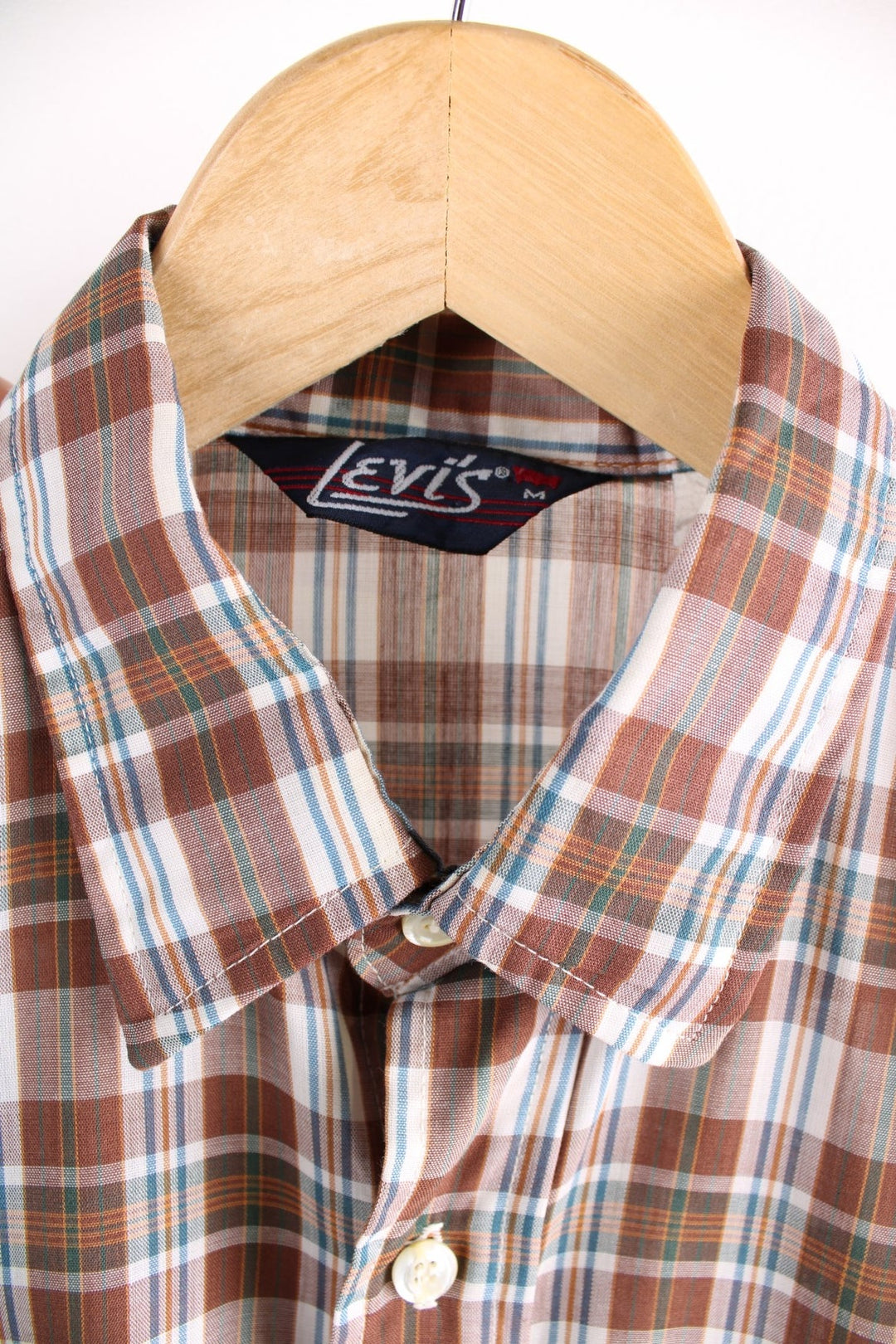 Levi Strauss white tab shirt in brown, white, and blue check, with two buttoned pockets.