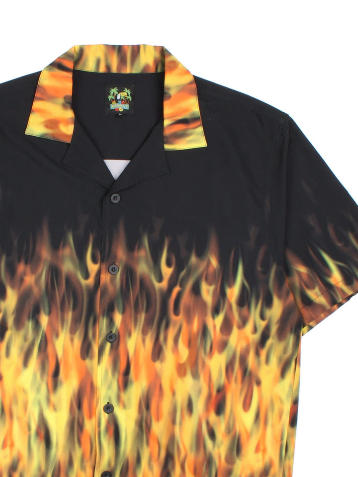 Vintage flame graphic shirt in a black and yellow/orange colourway. The shirt has an open collar and buttons to close. 