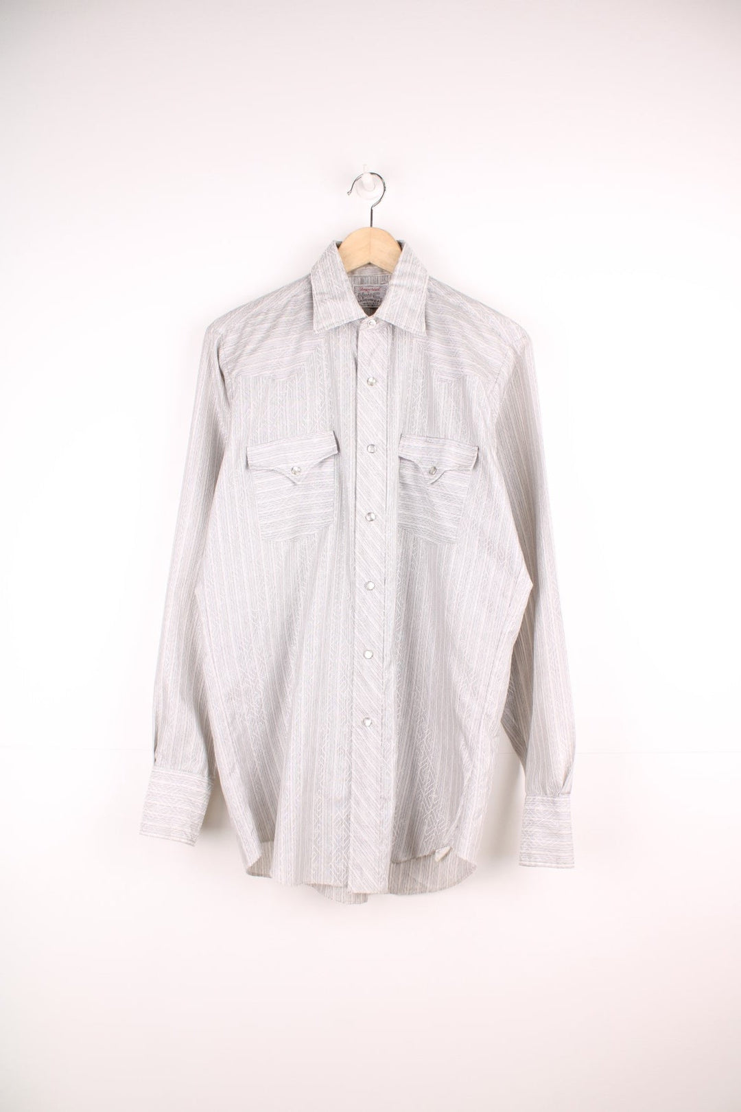Vintage 70s H Bar C Ranchwear long sleeved shirt with black stripes and silver geometric pattern. Features popper fastenings and chest pockets.