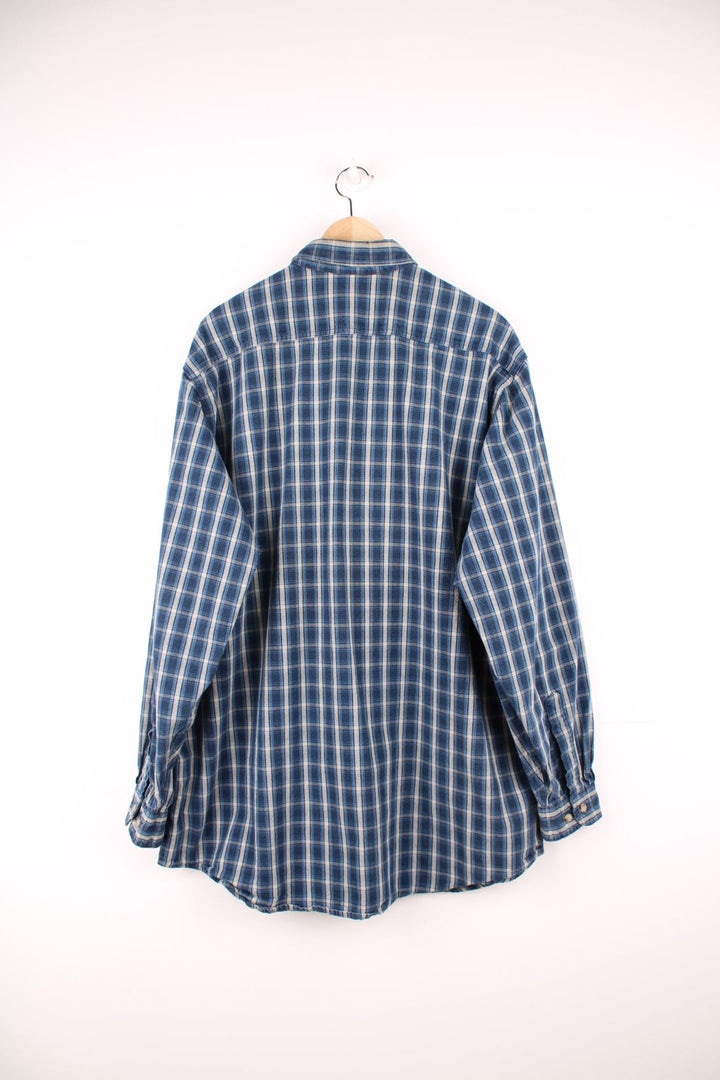 Blue and white Carhartt button through shirt. Features chest pocket and embroidered leather logo.