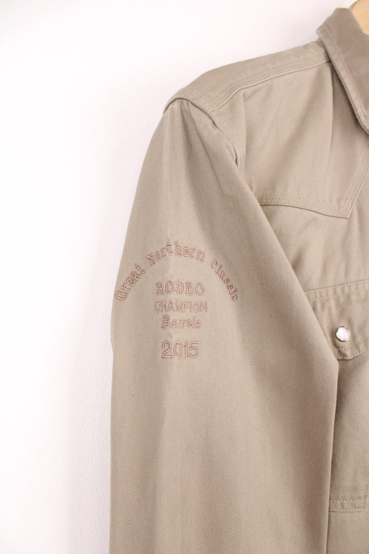 Carhartt western style shirt with pearl snap fastenings and Great Northern Classic, Rodeo Champion Barrels 2015 embroidery on the sleeve. 