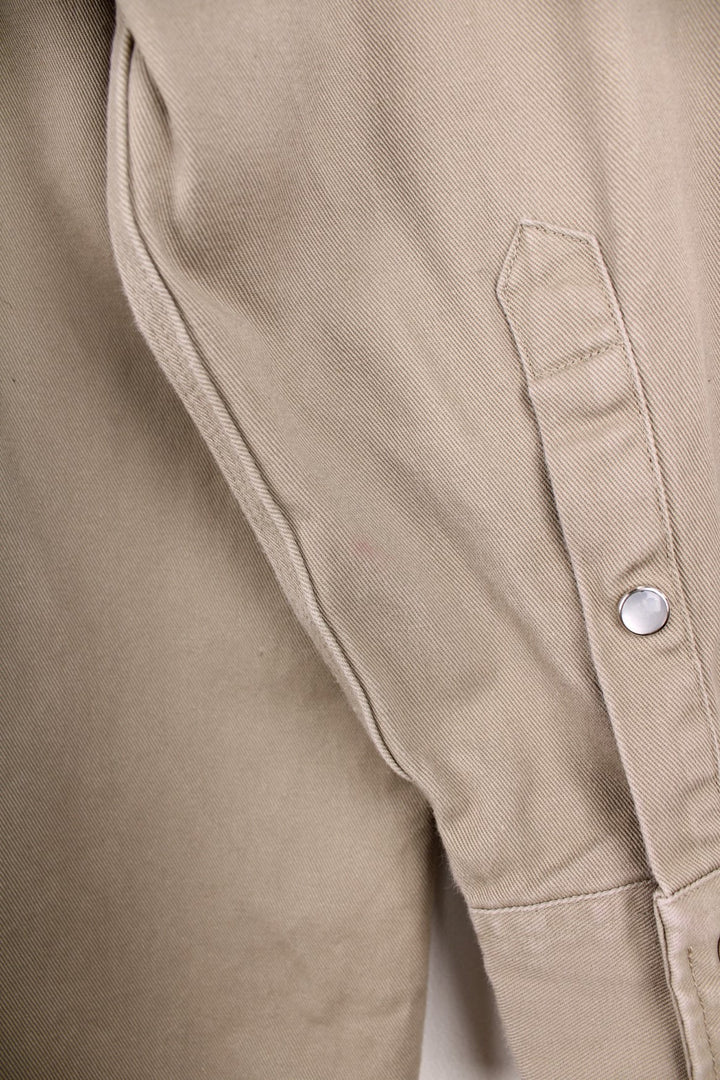 Carhartt western style shirt with pearl snap fastenings and Great Northern Classic, Rodeo Champion Barrels 2015 embroidery on the sleeve. 