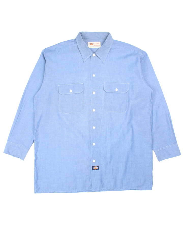 Dickies Work Shirt in a blue colourway, button up and has double chect pockets with the logo embroidered on the front.