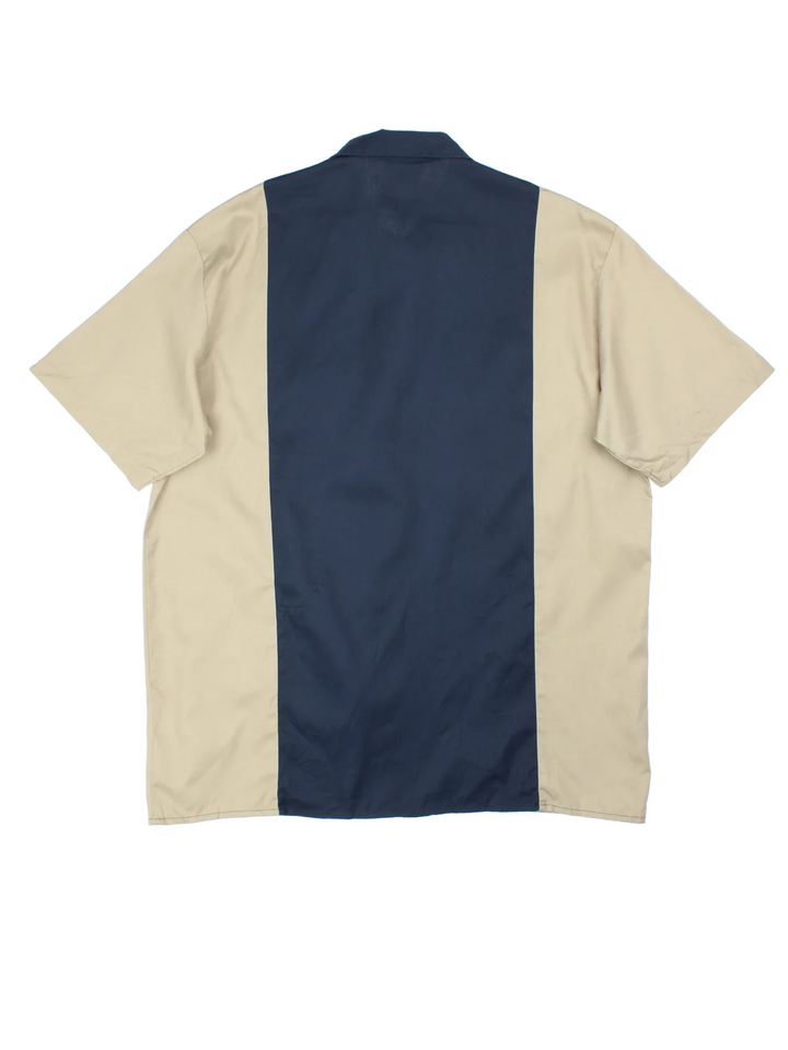 Dickies Two Tone Work Shirt in a blue and tan colourway, button up and has double chest pockets with the logo embroidered on the front.