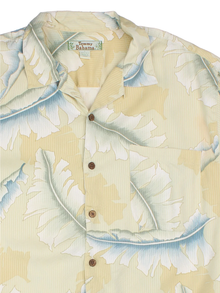 Vintage Tommy Bahama Hawaiian Shirt in a yellow colourway, button up and has a chest pocket.