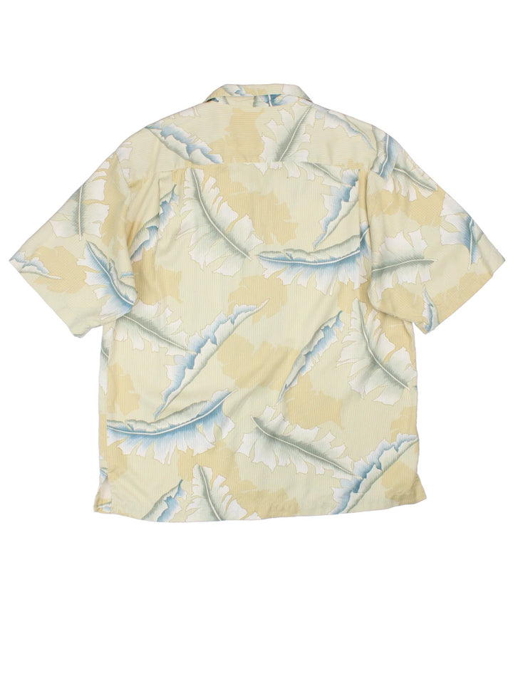 Vintage Tommy Bahama Hawaiian Shirt in a yellow colourway, button up and has a chest pocket.