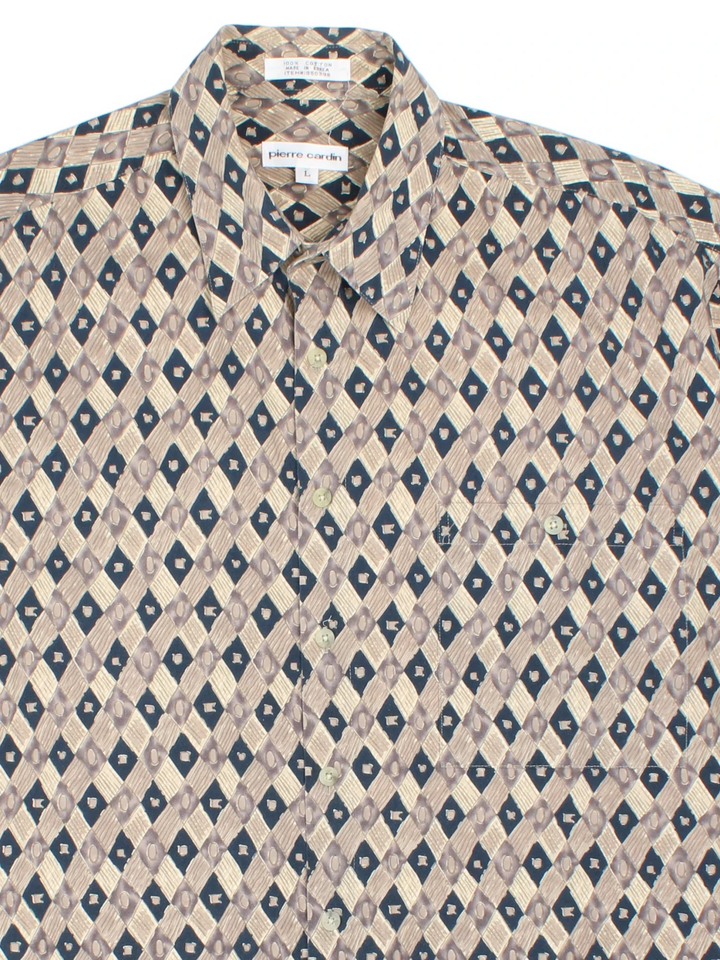 Vintage Pierre Cardin Abstract Pattern Shirt in a tan and navy colourway, button up and has a chest pocket.
