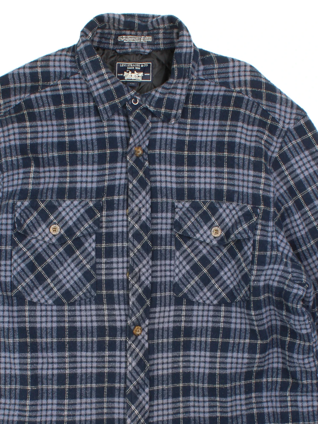 Levi Strauss Flannel Jacket in a blue colourway. Buttons up and has double chest pockets and insulated with a quilted lining.