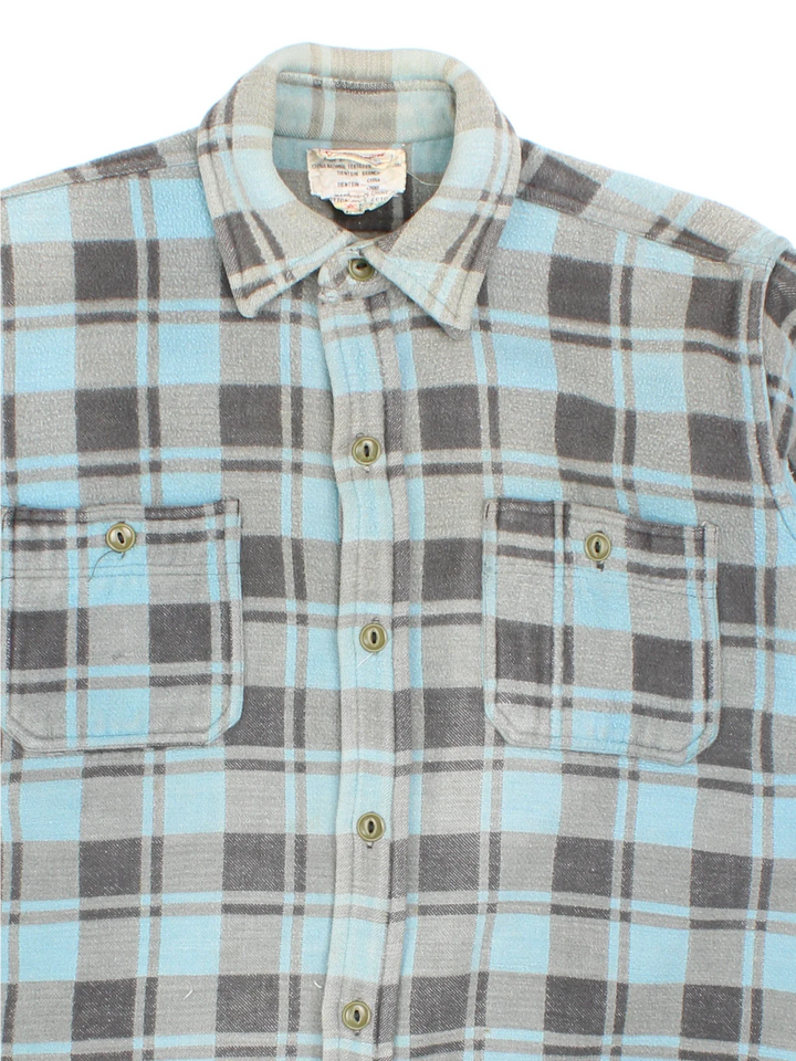 1960's Champion Flannel Shirt in a blue colourway, button up with double chest pockets.