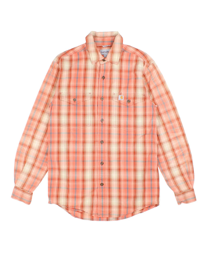 Carhartt Shirt in a orange plaid colourway, buttons up and has double chest pockets with the logo embroidered on the front.