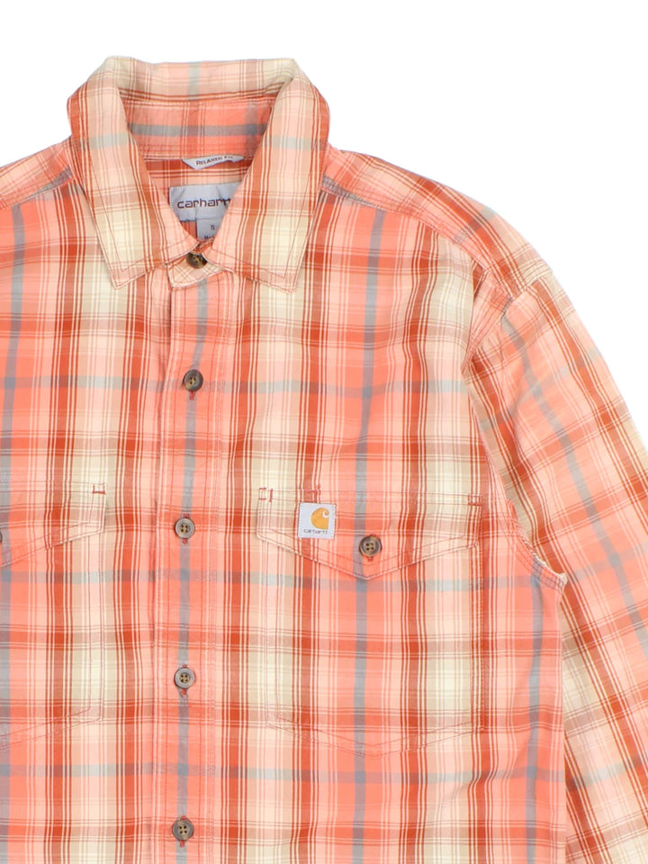 Carhartt Shirt in a orange plaid colourway, buttons up and has double chest pockets with the logo embroidered on the front.