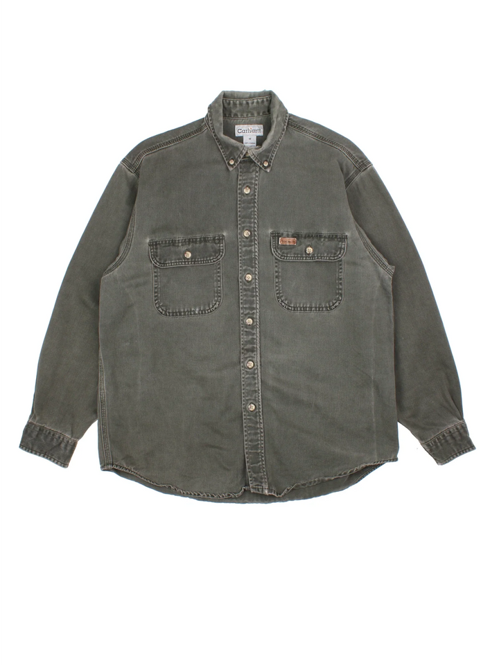 Carhartt Work Shirt in a khaki green colourway, buttons up and has double chest pockets with the logo embroidered on the front.