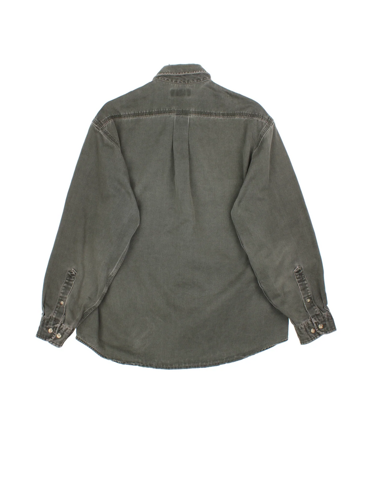 Carhartt Work Shirt in a khaki green colourway, buttons up and has double chest pockets with the logo embroidered on the front.
