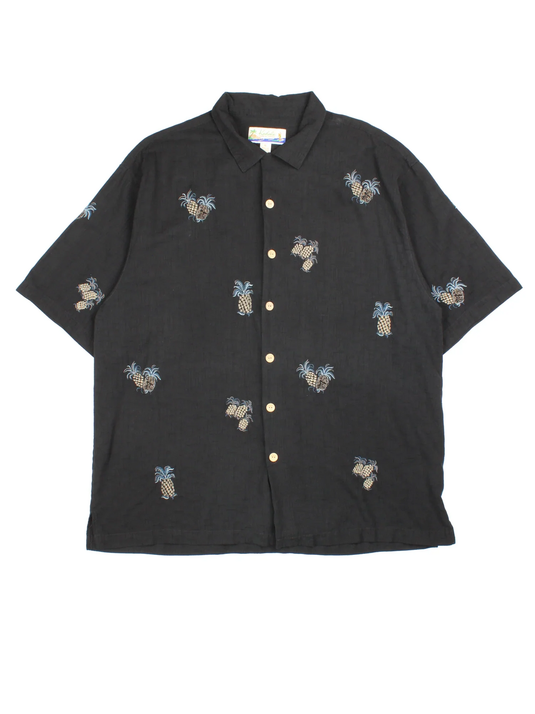 Vintage Pineapple Hawaiian Shirt in a black colourway, buttons up and has pineapples embroidered all over.