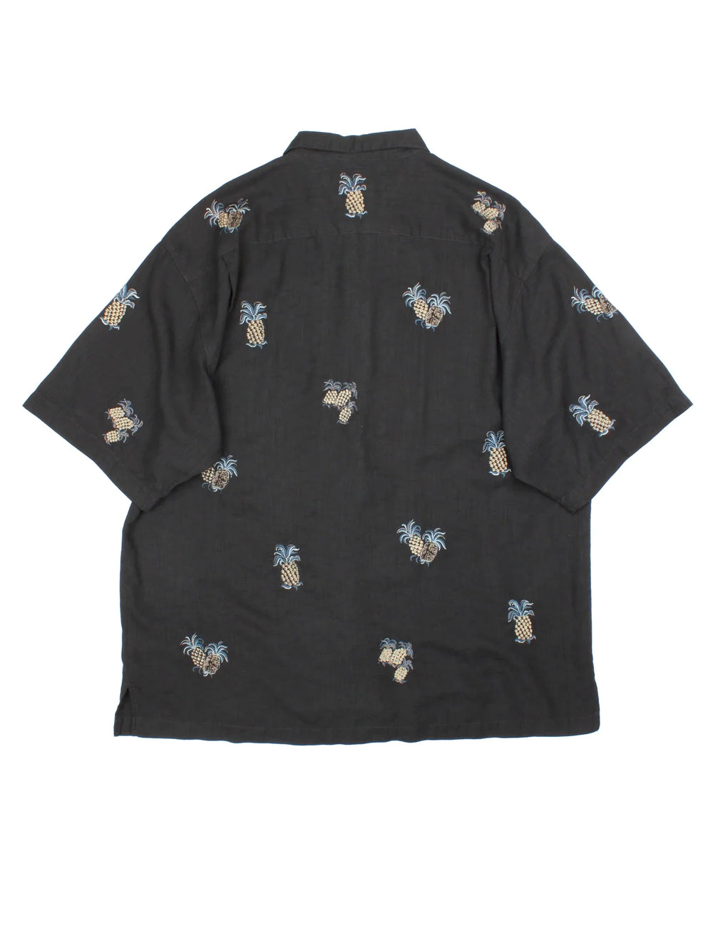 Vintage Pineapple Hawaiian Shirt in a black colourway, buttons up and has pineapples embroidered all over.