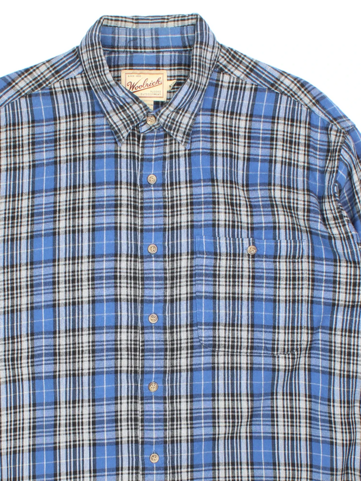 Vintage Woolrich Flannel Shirt in a blue, grey and black plaid pattern colourway, button up with a chest pocket.