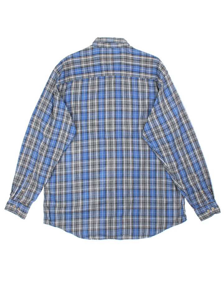 Vintage Woolrich Flannel Shirt in a blue, grey and black plaid pattern colourway, button up with a chest pocket.