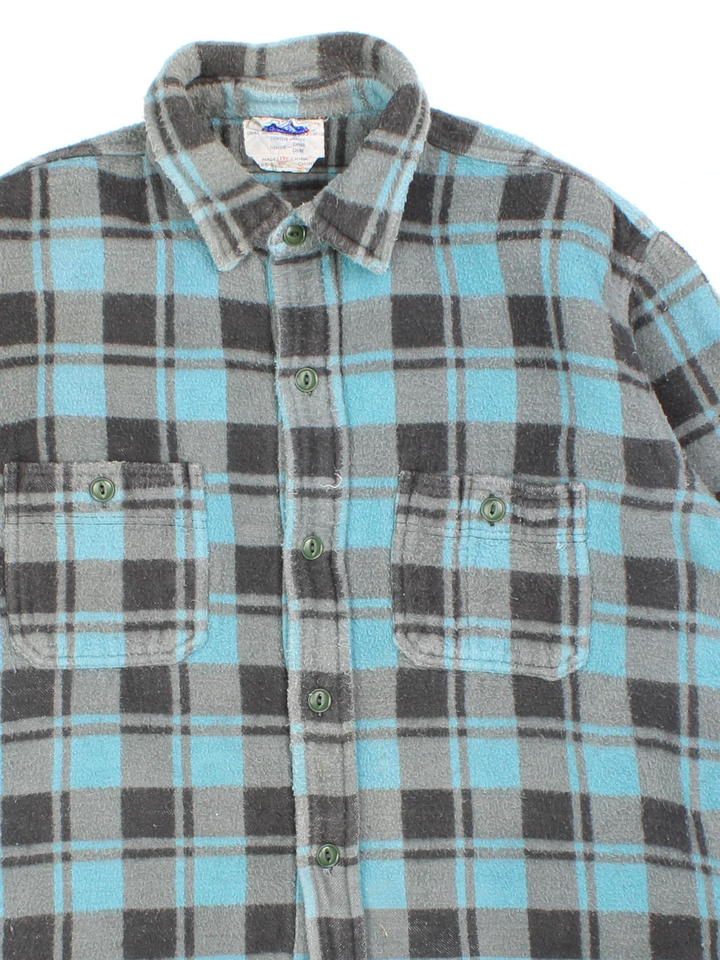 Vintage 1960 Champion Flannel Shirt Shirt in a blue and grey colourway, button up with double chest pockets.