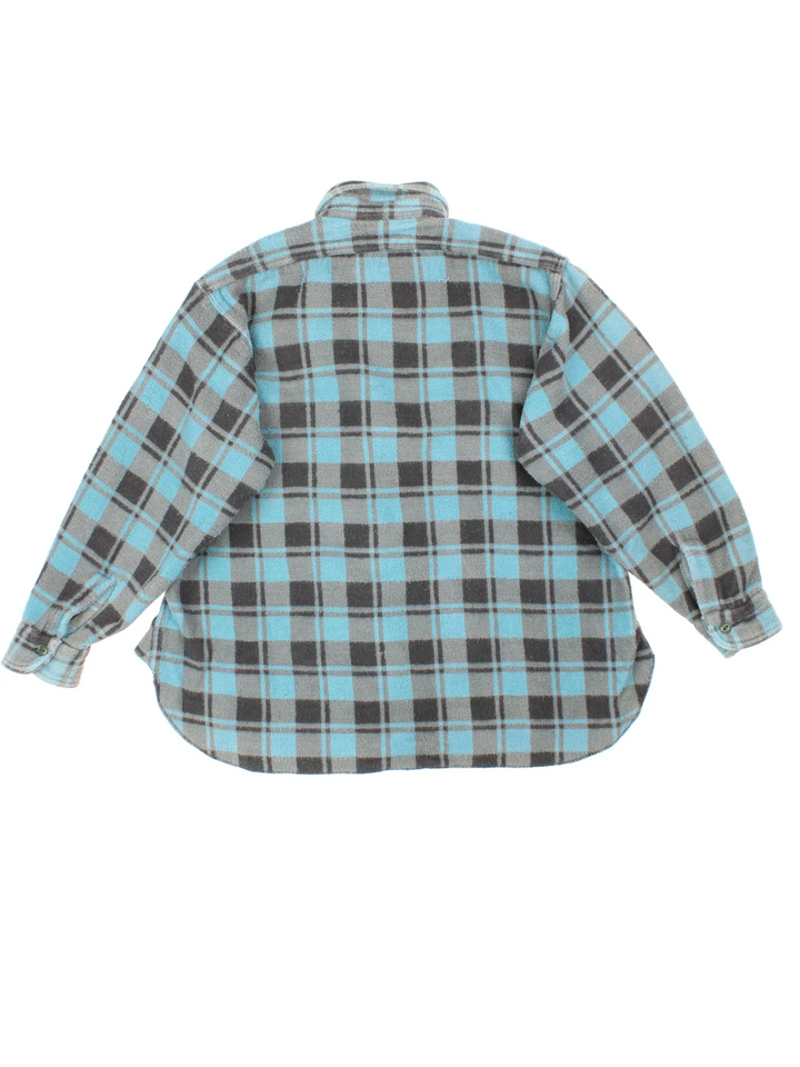Vintage 1960 Champion Flannel Shirt Shirt in a blue and grey colourway, button up with double chest pockets.