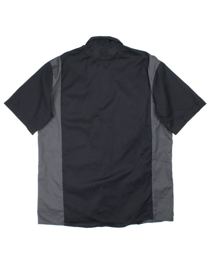 Vintage Dickies Work Shirt in a black and grey colourway, button up and has double chest pockets with the logo embroidered on the front.