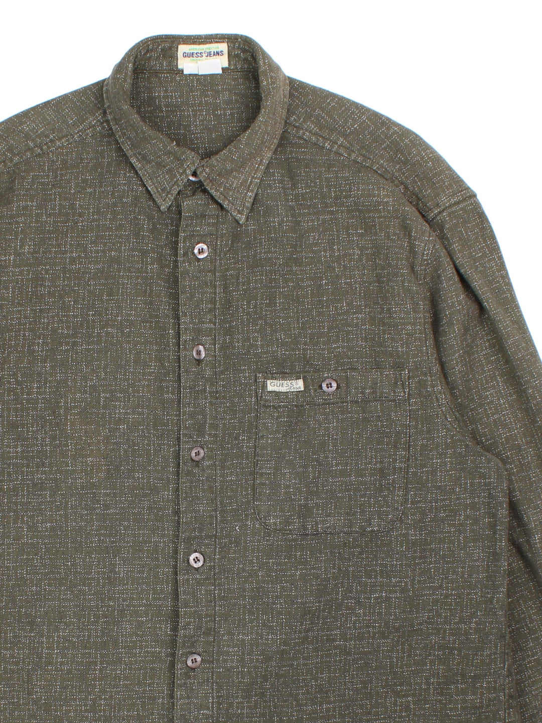 Guess Flannel Shirt in a green colourway with light fleck pattern. Classic button up with front pocket.