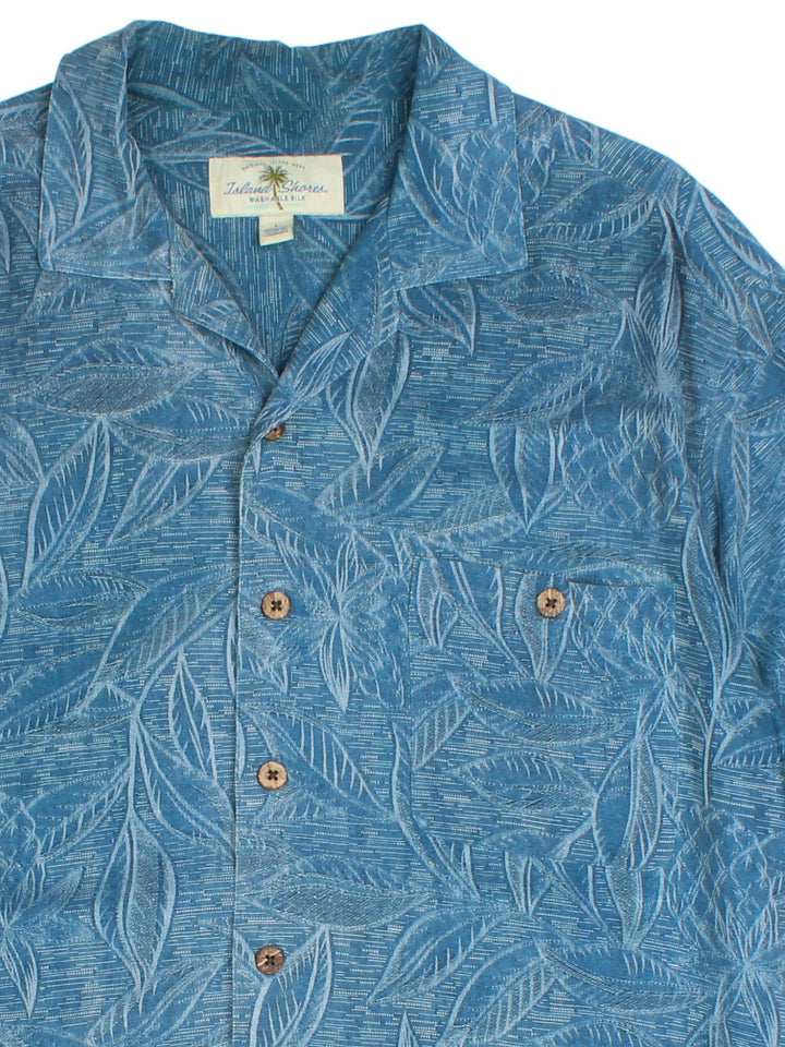 Vintage Hawaiian Shirt in a blue colourway, all over palm tree print detail and front pocket.
