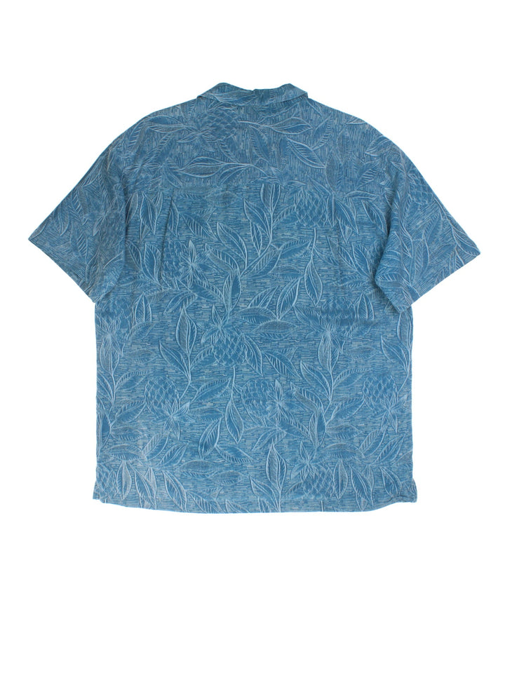 Vintage Hawaiian Shirt in a blue colourway, all over palm tree print detail and front pocket.