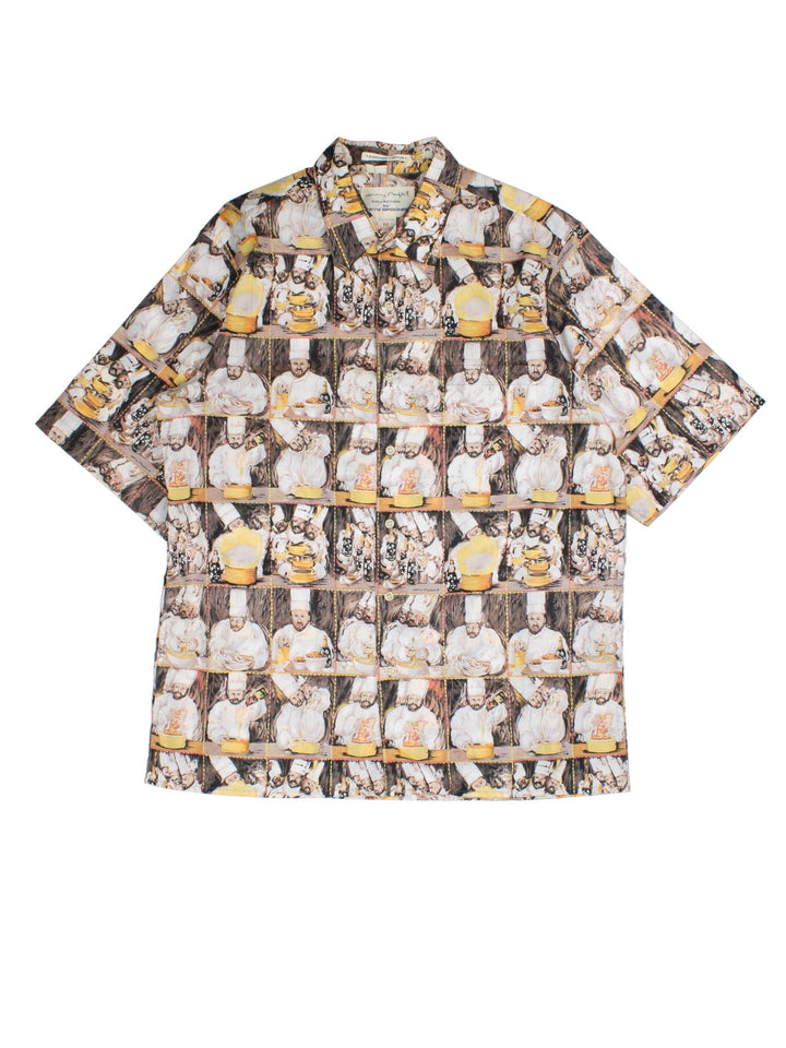 Vintage Reyn Spooner Chefs Shirt in a brown/yellow colourway, all over chef pattern print and front patch pocket.