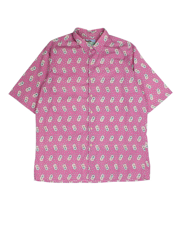 Vintage Reyn Spooner Hawaiian Shirt in a pink colourway, all over abstract flower pattern and front patch pocket.